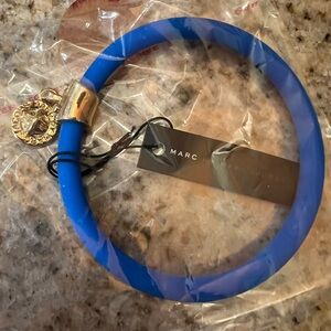 Marc By Marc Jacobs Blue
Gold Tone TurnLock Charm
Rubber Stretch Bracelet
NWT